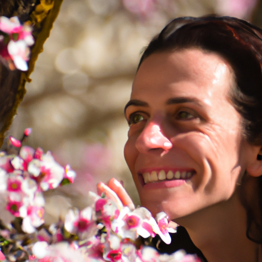 אישה נהנית בחוץ, מוקפת בפרחים פורחים, המייצגת את תחילת האביב ואת החשיבות של עדכון שגרת טיפוח העור שלה.